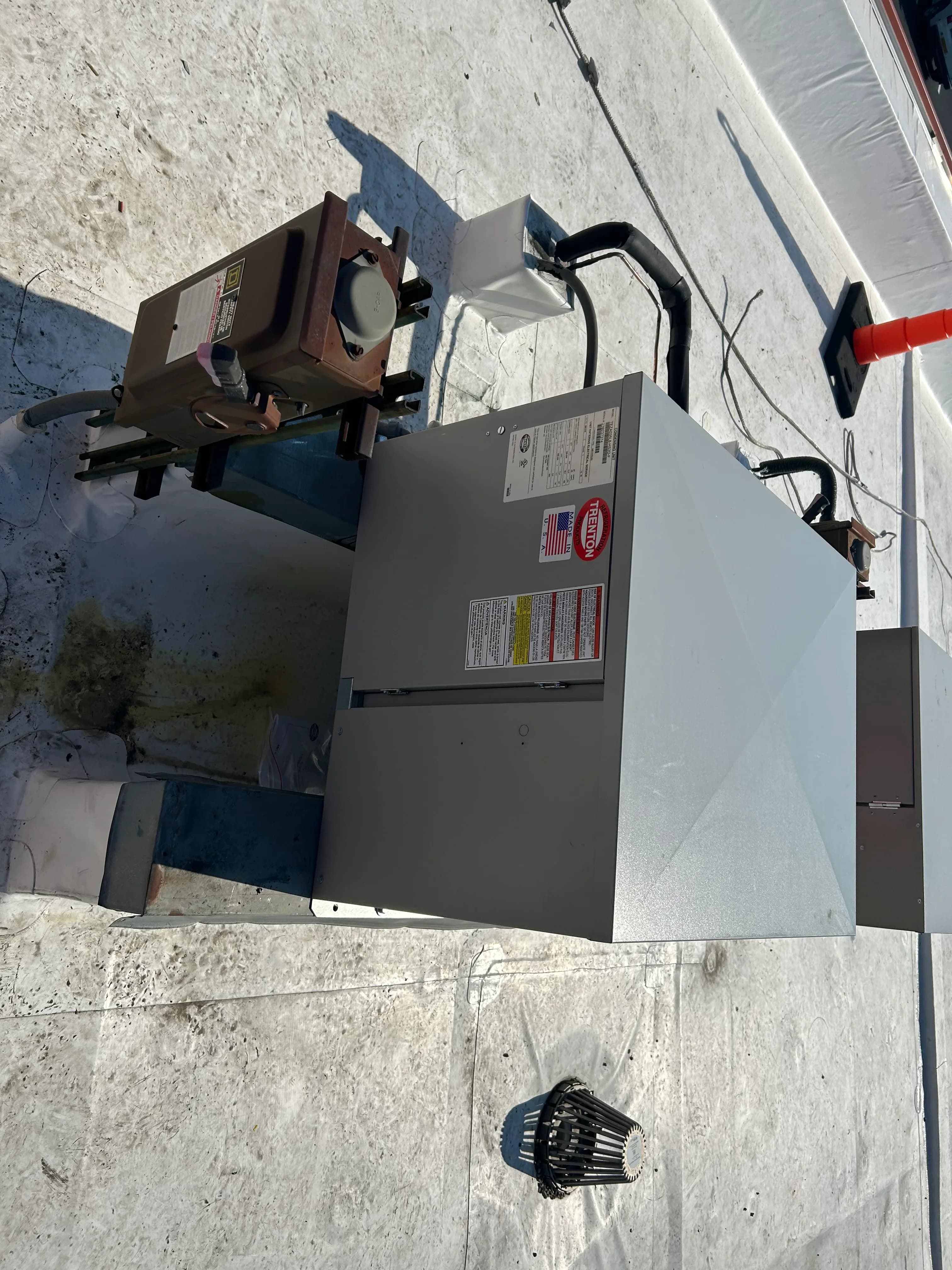 A rooftop HVAC and refrigeration unit installed on a commercial roof